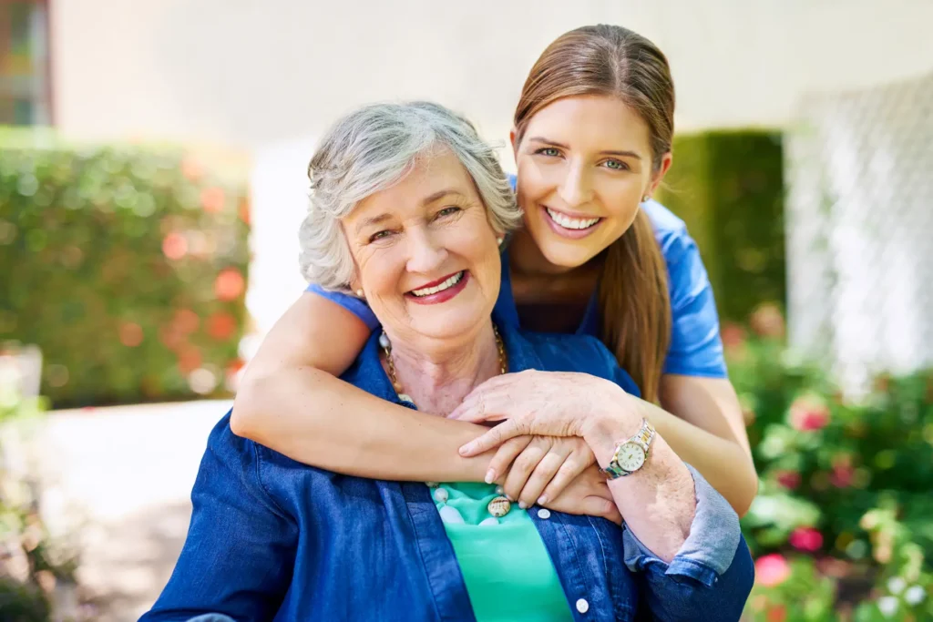 An elderly client shares a moment of trust and conversation with her dedicated, consistent carer in the comfort of her own home.